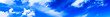 Horizontal wide high altitude dramatic blue loudscape panorama b