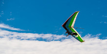 Hang Glider Flying In Blue Sly