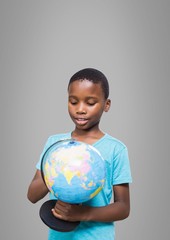 Poster - Boy against grey background with world globe