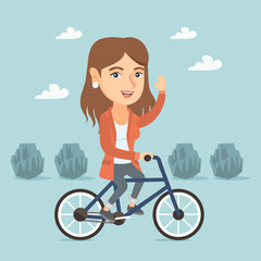 Poster - Caucasian sportive woman riding a bicycle in the park. Cyclist riding bicycle and waving hand. Young woman on a bicycle outdoors. Healthy lifestyle concept. Vector cartoon illustration. Square layout.