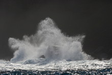 The Splash Of Waves Hitting The Rocks