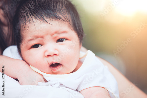 Cute Asian Newborn Baby Girl Resting On Mothers Shoulder Mom