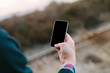 © Melanie Riccardi Photography/Stocksy - Man using iPhone