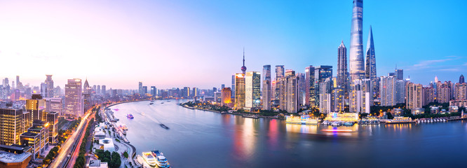 modern buildings near water at twilight