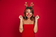 © Drobot Dean - Portrait of an excited smiling girl wearing christmas deer costume