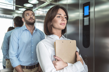 Wall Mural - Business couple is rising in elevator