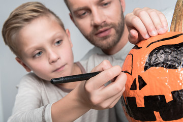 Wall Mural - father and son with halloween pumpkin