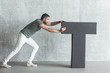 © Yakobchuk Olena - Stylish bristled guy is shoving large symbol