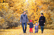 © alexkich - Family in autumn park in the afternoon