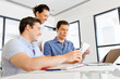 © Sergey Nivens - Group of happy young business people in a meeting