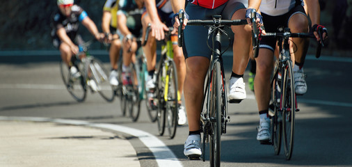 Wall Mural - Cyclists with racing bikes during the cycling road race,when climbing uphill