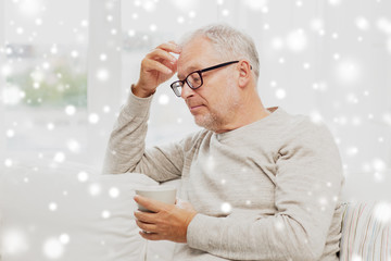 Wall Mural - senior man with cup of tea at home