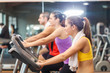 © Minerva Studio - Group of people doing fitness in a gym