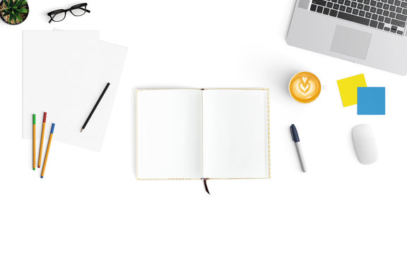 Modern workspace with coffee cup, smartphone, paper, notebook, tablet and laptop copy space on white color background. Top view. Flat lay style.