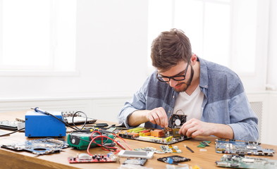 Poster - Technician plug in microprocessor to motherboard