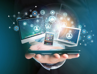 Poster - Computer and devices displayed on a futuristic interface with business network - Multimedia and technology concept