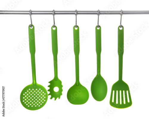 Set Of Cooking Utensils Hanging On Rack Isolated White Set Of Cooking Utensils Hanging On Rack Isolated White