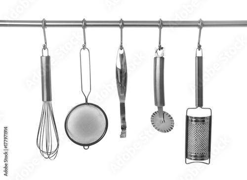 Set Of Cooking Utensils Hanging On Rack Isolated White Set Of Cooking Utensils Hanging On Rack Isolated White