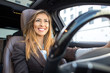 © Marko - Beautiful businesswoman smiling in a car