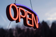 © Deirdre Malfatto/Stocksy - neon open sign hanging outside in the dusk