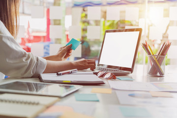 Leinwandbilder - Businesswoman using laptop computer at the office