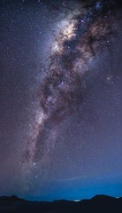 Wall Mural - landscape with milky way galaxy over mountain. night sky with stars. long exposure photograph.