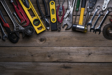 Wall Mural - Old tools equipment with blackboard on wood table background, engineering concept