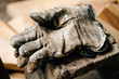 © Deirdre Malfatto/Stocksy - a man's worn work gloves at rest