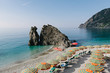 © Preappy/Stocksy - Umbrellas on the beach of Monterosso al Mare