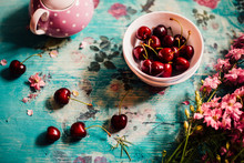 Cherries And Flowers On The Vintage Table