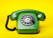 © Maksym Dykha - Old green telephone on a yellow background