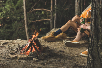 couple on hiking trip drinking beer