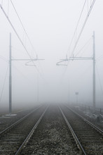 Railroad Tracks In The Fog