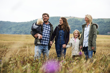 Wall Mural - Family Generations Parenting Togetherness Field Nature Concept