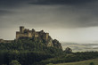 © EKerkman Photography/Stocksy - Medieval  castle in the hills on a cloudy day.