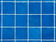 © Angela Lumsden/Stocksy - Grid of blue swimming pool tiles