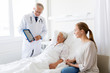 © Syda Productions - senior woman and doctor with tablet pc at hospital