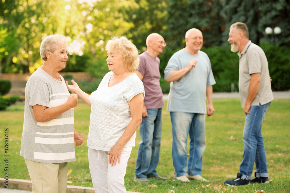 Group of elderly people resting in park