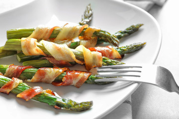 Sticker - Plate with bacon wrapped asparagus on table, closeup