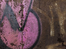 Old Rusted Metal Door With Pink Graffiti