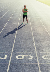 Wall Mural - sprinter standing on running track
