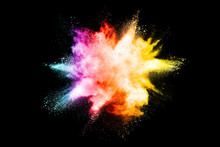 Explosion Of Colored Powder Isolated On Black Background.