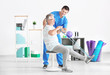© Africa Studio - Physiotherapist working with senior patient in modern clinic