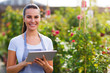 Garden center worker using digital tablet

