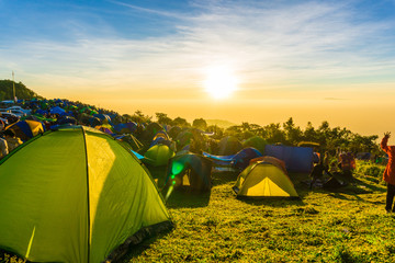 Camping tent on the hill sunrise time colourful sky