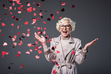 Wall Mural - excited senior woman with confetti