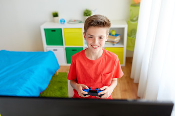 Sticker - boy with gamepad playing video game on computer