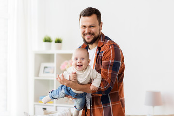 happy father with little baby boy at home
