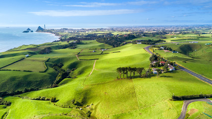 Aerial view on Taranaki coastline with farms and New Plymouth on the background. Taranaki region, New Zealand