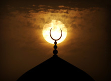 Setting Sun Behind A Mosque In Dubai